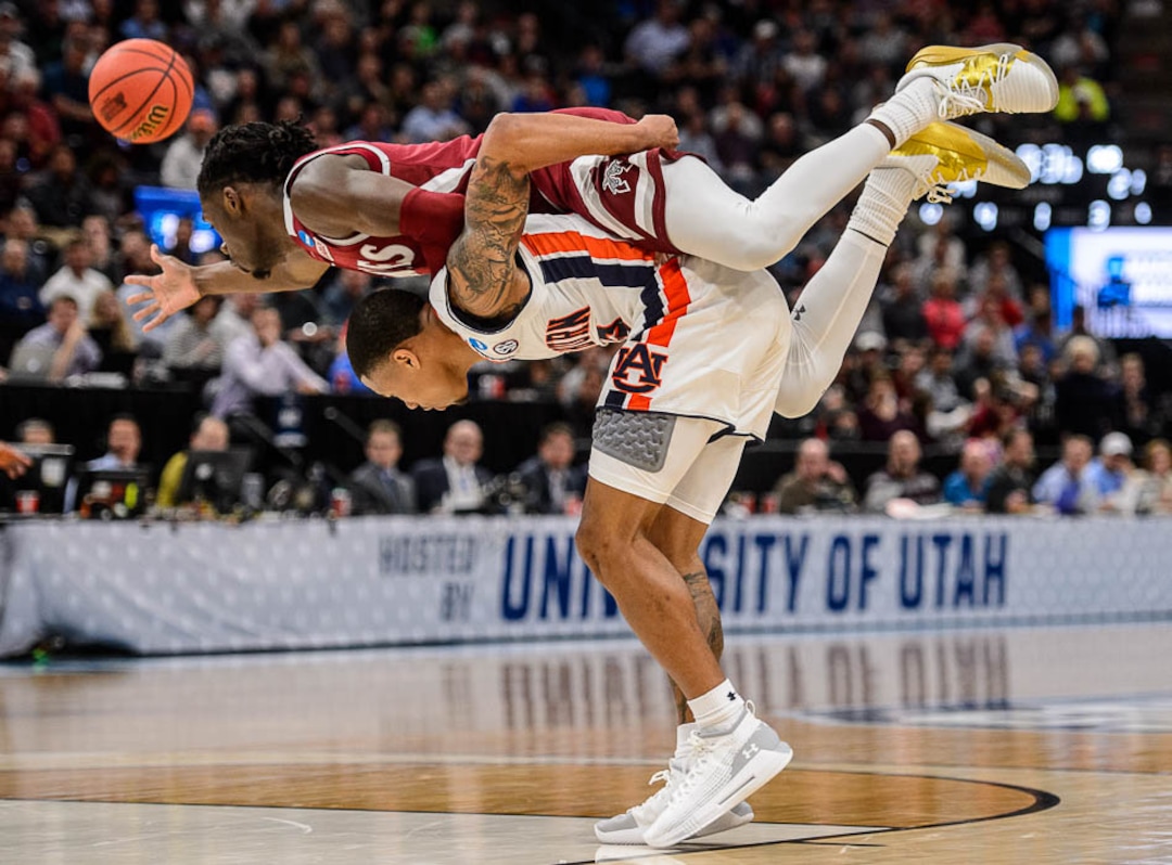 (Trent Nelson | The Salt Lake Tribune)  New Mexico State Aggies guard Clayton Henry (5) on top of Auburn Tigers guard J'Von McCormick (12) as Auburn faces New Mexico State in the 2019 NCAA Tournament in Salt Lake City on Thursday March 21, 2019.