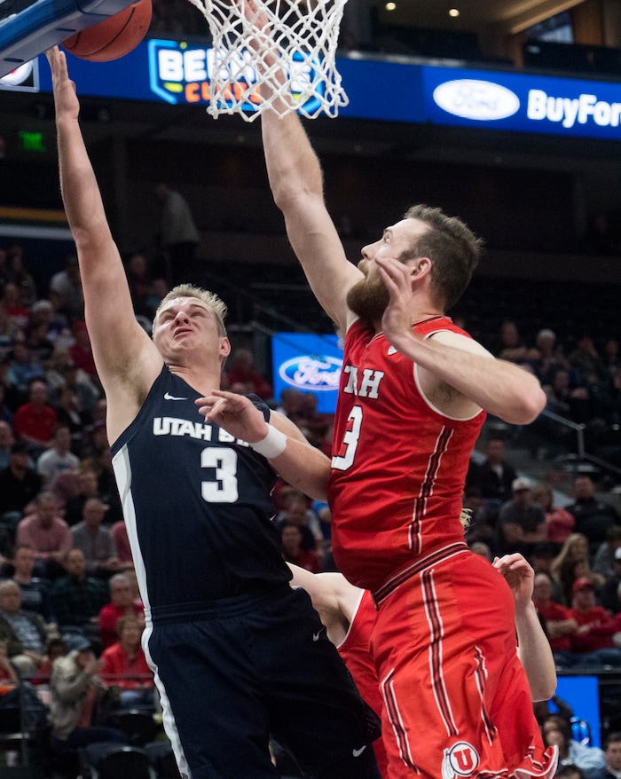 (Rick Egan  |  The Salt Lake Tribune)  UUtah State Aggies guard Sam Merrill (3)  shoots as Utah Utes forward David Collette (13)defends, in Beehive Classic basketball action at the Vivint SmartHome Arena, Saturday, December 9, 2017.