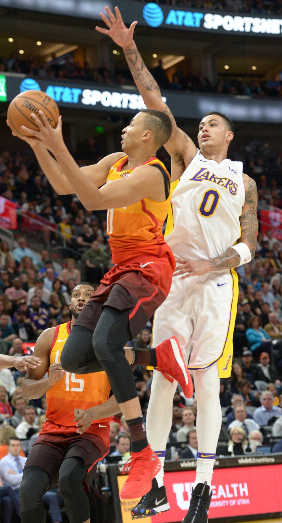 (Leah Hogsten  |  The Salt Lake Tribune)  Utah Jazz guard Dante Exum (11) slips past Los Angeles Lakers forward Kyle Kuzma (0) as the Utah Jazz host the Los Angeles Lakers at Vivint Smart Home Arena Tuesday, April 3, 2018