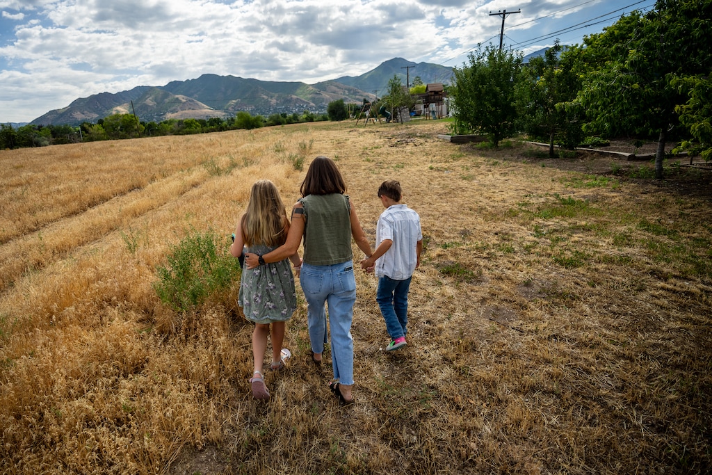 (Trent Nelson  |  The Salt Lake Tribune) Amy Beckler with her children Jada and Tate in open space behind their Salt Lake City home on Wednesday, July 1, 2026.