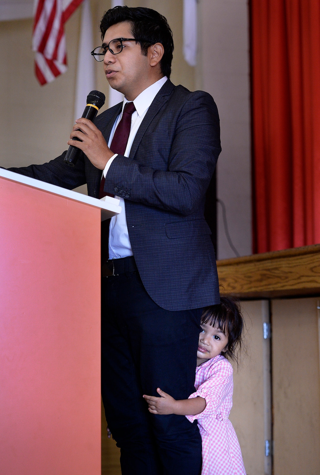 (Scott Sommerdorf   |  The Salt Lake Tribune)   Deyvid Morales speaks while being visited by his daughter "Lala" at the rally entitled "#SummerResistance Day of Action: Protecting DACA," put on by the Utah State Democratic Party and Utah State Democratic Hispanic Caucus at the Centro Civico Mexicano, Sunday, August 20, 2017. 