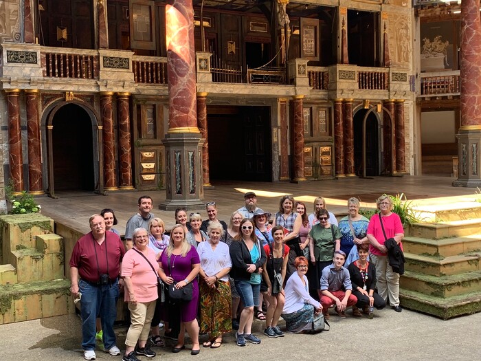 (Photo courtesy of Megan Gutierrez)  Theater Lovers Travel members take a photo together in August 2019 during a private tour of the Globe Theater in London.
