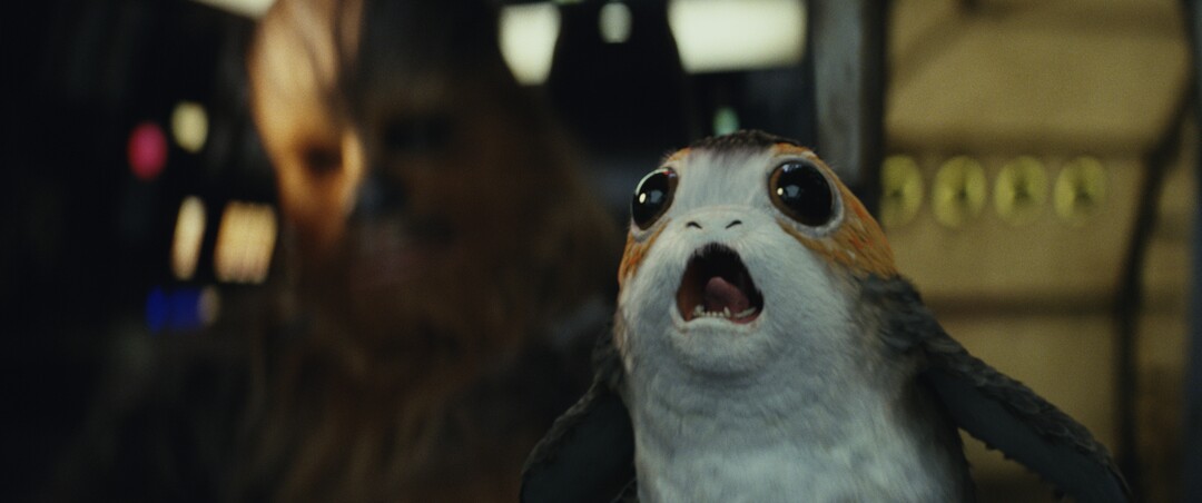 This image released by Lucasfilm shows Chewbacca, left, and a Porg in a scene from "Star Wars: The Last Jedi." (Lucasfilm via AP)
