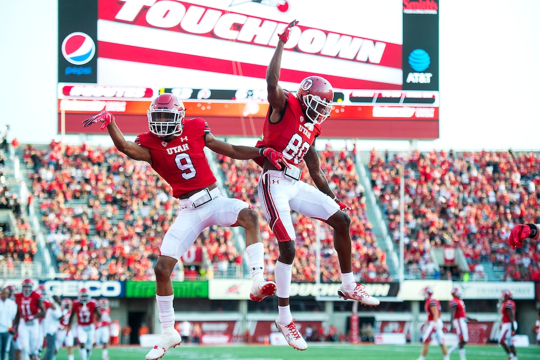 (Chris Detrick  |  The Salt Lake Tribune)  Utah Utes wide receiver Darren Carrington (9) celebrates his touchdown with Utah Utes wide receiver Siaosi Wilson (80) during the game at Rice-Eccles Stadium Thursday, August 31, 2017. Utah Utes are leading North Dakota Fighting Hawks 17-9 at halftime. 