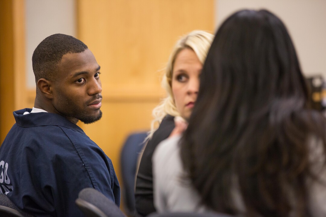 Former Utah State University linebacker Torrey Green leans toward his defense attorney, Skye Lazaro, in the 1st District Court on Thursday Ñ the second day of a three-day preliminary hearing. Green is charged with six counts of rape, one count of aggravated kidnapping, three counts of forcible sex abuse and two counts of object rape. (Tim Carpenter/Utah Statesman)