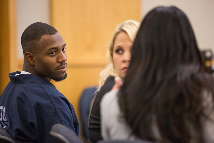 Former Utah State University linebacker Torrey Green leans toward his defense attorney, Skye Lazaro, in the 1st District Court on Thursday Ñ the second day of a three-day preliminary hearing. Green is charged with six counts of rape, one count of aggravated kidnapping, three counts of forcible sex abuse and two counts of object rape. (Tim Carpenter/Utah Statesman)