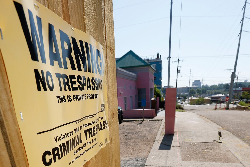 (Rogelio V. Solis | AP) A "No Trespassing" sign is posted along the fencing protecting the parking lot of the Jackson Women's Health Organization, Friday, May 17, 2019, in Jackson, Miss. The facility is the state's only abortion clinic.