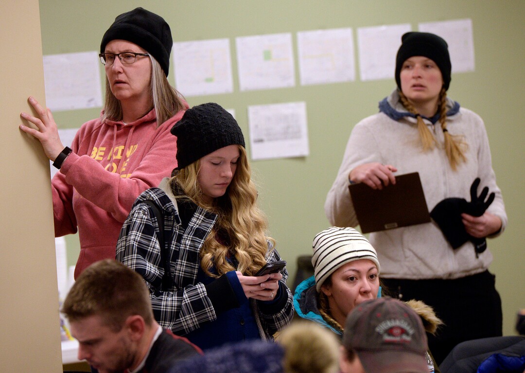 (Al Hartmann  |  The Salt Lake Tribune)  Dozens of volunteers dressed for the cold wait to get their assignments at 3:45 a.m Thursday, Jan. 25, 2018,  for the annual Point In Time count of homeless people in Salt Lake City.