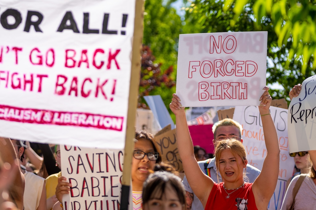 (Trent Nelson  |  The Salt Lake Tribune) People march through downtown Provo, protesting after the U.S. Supreme Court overruled Roe v. Wade, on Saturday, June 25, 2022.