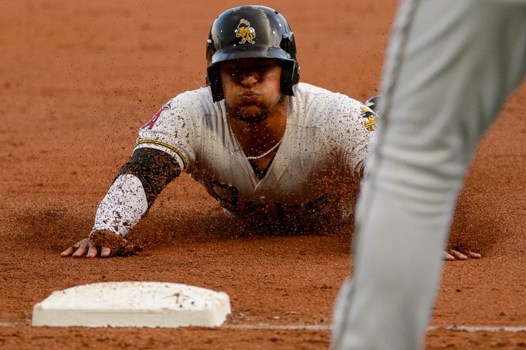 (Trent Nelson | The Salt Lake Tribune)  Salt Lake Bees vs. Albuquerque Isotopes, Triple-A baseball in Salt Lake City, Thursday April 5, 2018. Salt Lake's Jose Briceno (10) dives into third in the second inning.