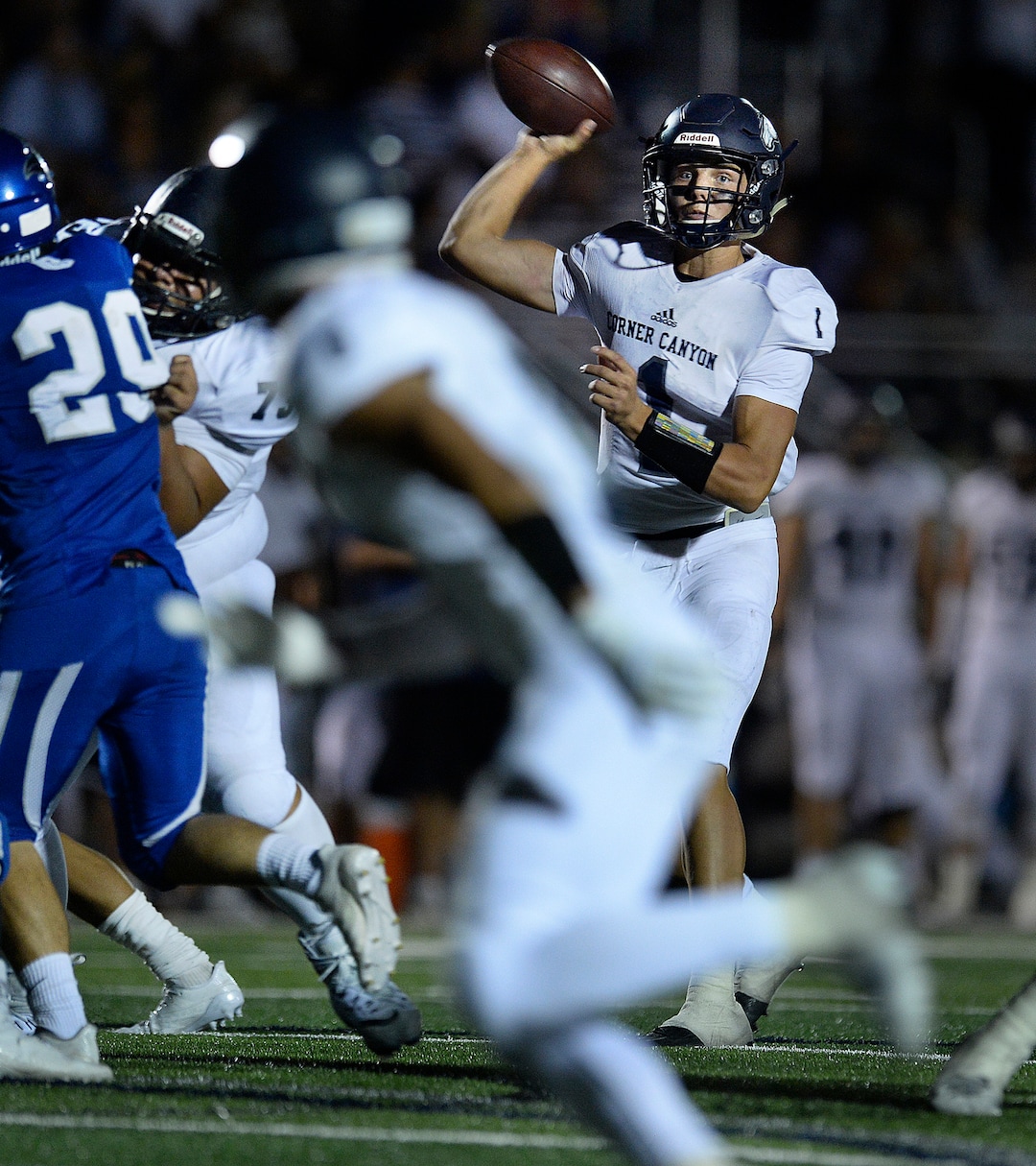 (Scott Sommerdorf   |  The Salt Lake Tribune)   Corner Canyon QB Zach Wilson passes during second half play as Corner Canyon defeated Pleasant Grove 31-10 to start the season, Friday, August 18, 2017. 