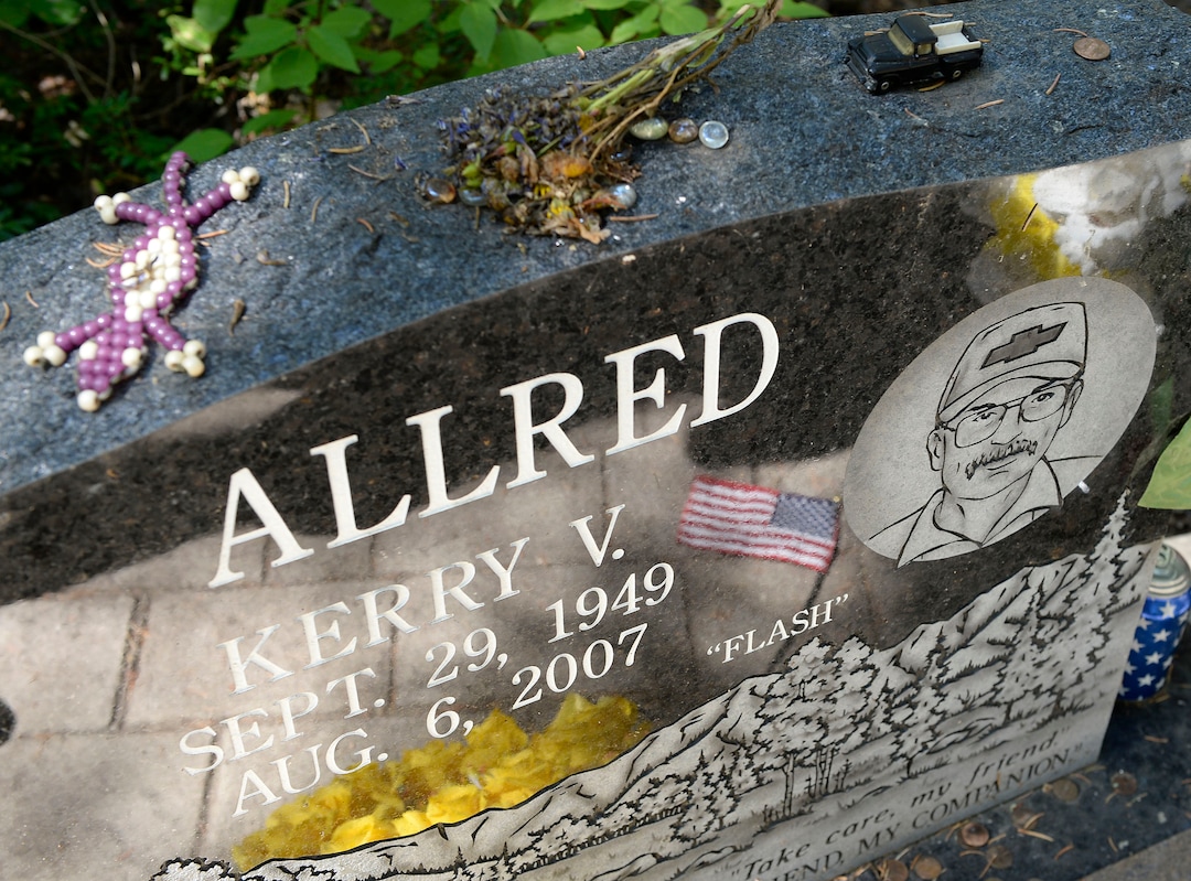 (Al Hartmann  |  The Salt Lake Tribune)  Kerry Allred's memorial stone is seen in a grove of pine and aspen trees near the now-closed Crandall Canyon coal mine.