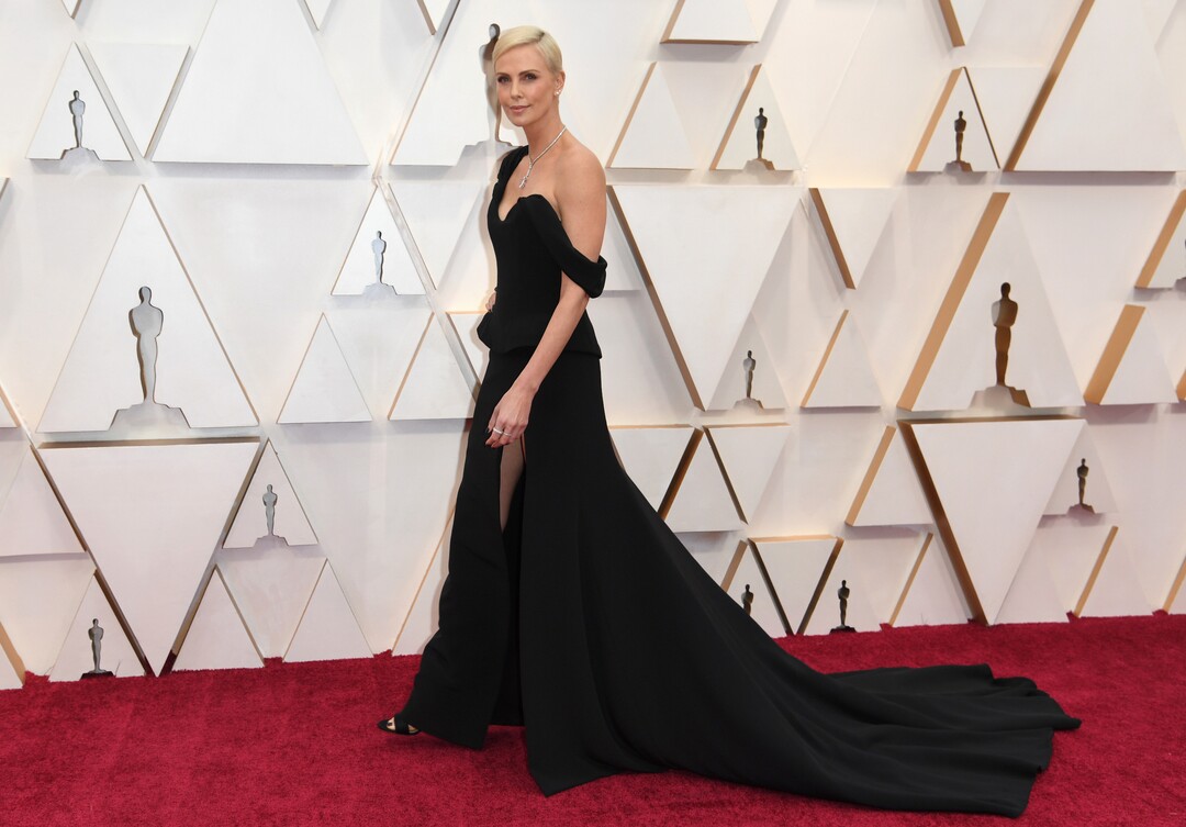 (Richard Shotwell | Invision/AP)  Charlize Theron arrives at the Oscars on Sunday, Feb. 9, 2020, at the Dolby Theatre in Los Angeles.