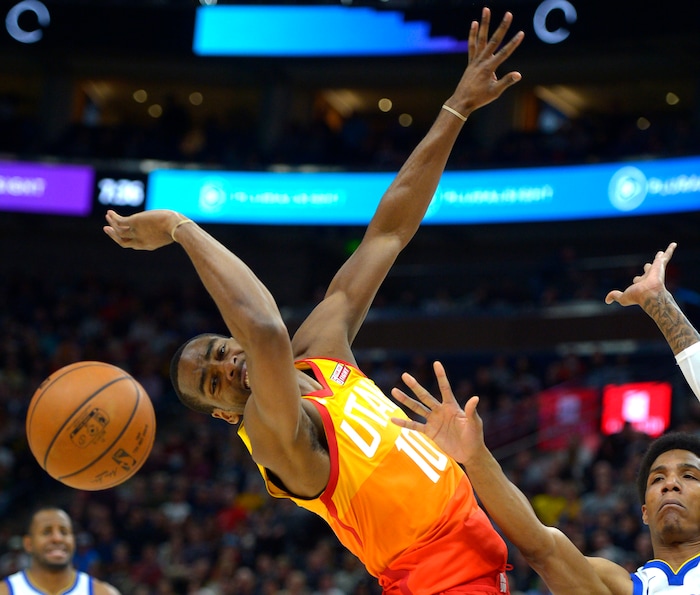 (Steve Griffin  |  The Salt Lake Tribune) Utah Jazz guard Alec Burks (10) gets fouled by Golden State Warriors guard Patrick McCaw (0) during the Utah Jazz versus Golden State Warriors at Vivint Smart Home Arena in Salt Lake City Tuesday January 30, 2018.