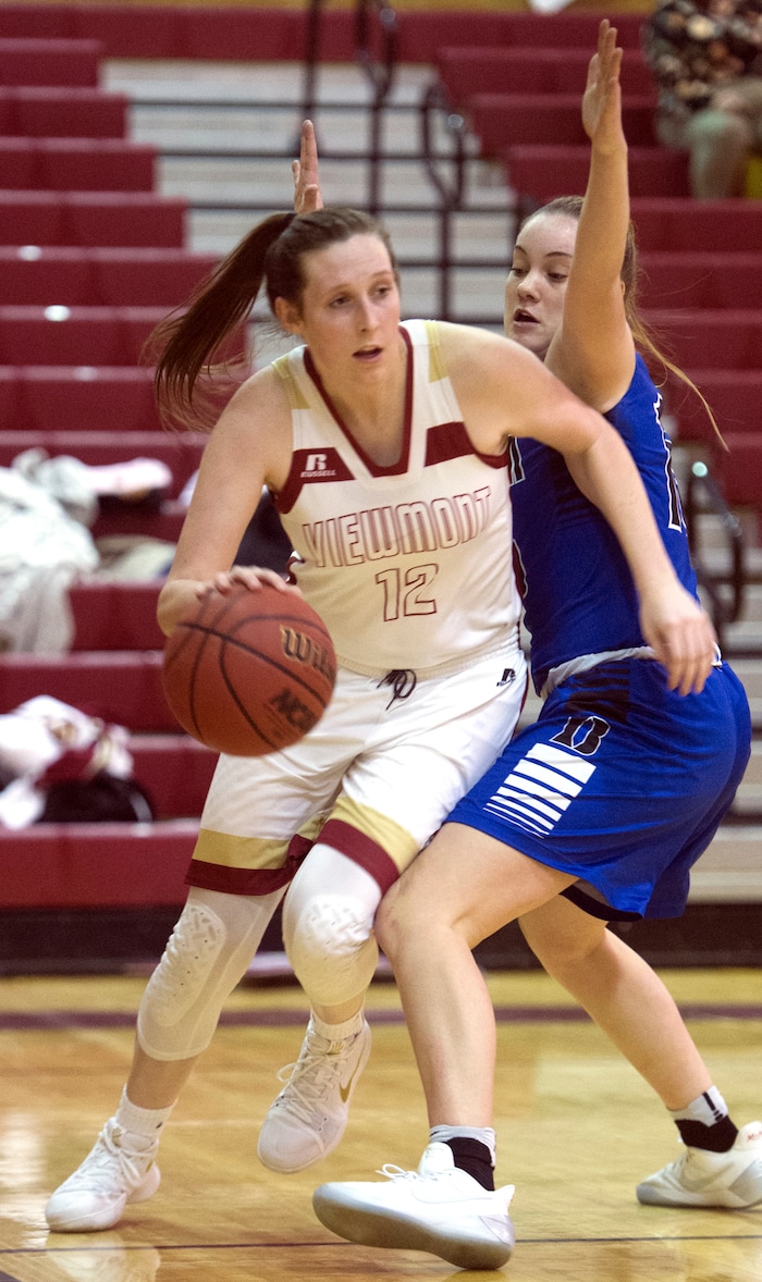 (Rick Egan  |  The Salt Lake Tribune)    Mercedes Staples (12) Viewmont, makes a move to the basket, as Maggie McCord (15) defends for Bingham, in prep basketball action, Bingham vs. Viewmont, in Bountiful, Wednesday, January 3, 2018.