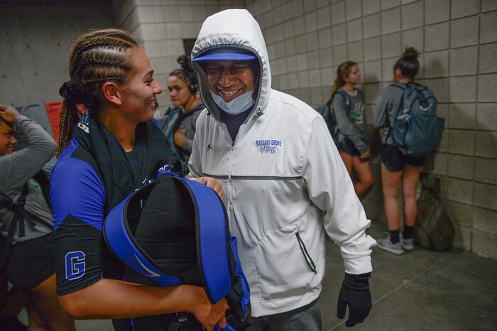 (Francisco Kjolseth  |  The Salt Lake Tribune)  Wayne Tarawhiti celebrates with her daughter Kazna after her team won their quarterfinal match up against Syracuse at the UCCU Center at Utah Valley University on Thursday, Nov. 2, 2017, defeating them in three straight sets. Wayne is battling a form of blood cancer and keeps covered up due to a compromised immune system. 