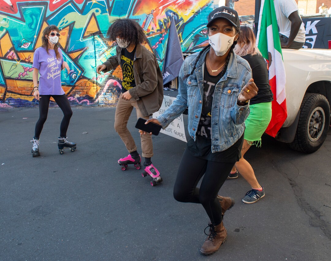 (Rick Egan | The Salt Lake Tribune)  Rania Ahmed (right), Zachary Taylor (center) and Natalie Blanton (left) dance during a Dance Dance 4 Revolution protest. Because of the jump in Covid-19 cases, organizers for Ourstreets, Dance Dance 4 Revolution streamed their virtual "March to the Polls" event from a back alley in Salt Lake City, Sunday, Nov. 1, 2020.