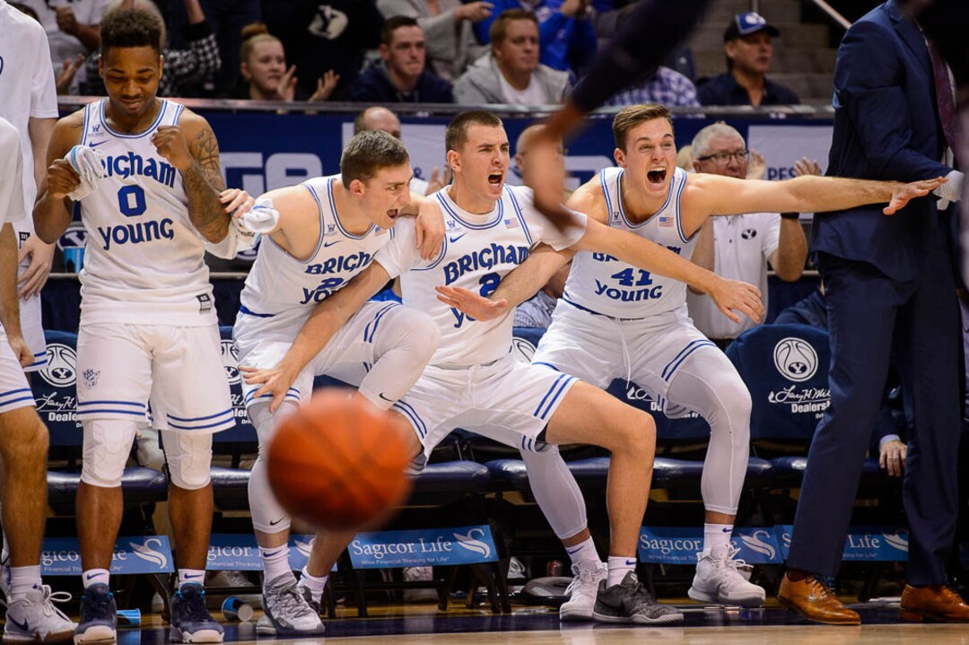 (Trent Nelson | The Salt Lake Tribune)  BYU's bench celebrates a foul as BYU hosts Utah State, NCAA basketball in Provo on Wednesday Dec. 5, 2018.