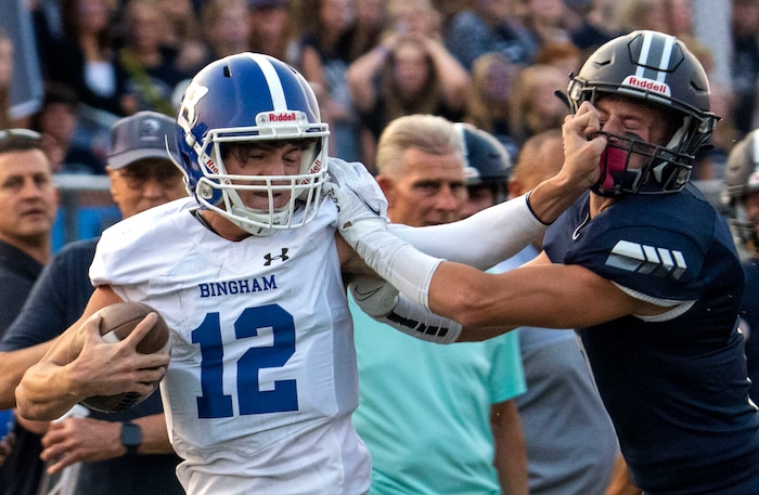 (Rick Egan | The Salt Lake Tribune) Dallen Martinez gets past Corner Canyon free safety Charlie Ebeling (7) as he runs the ball for the Chargers, in prep football action between the Corner Canyon Chargers and the Bingham Miners, on Friday, Aug. 27, 2021.