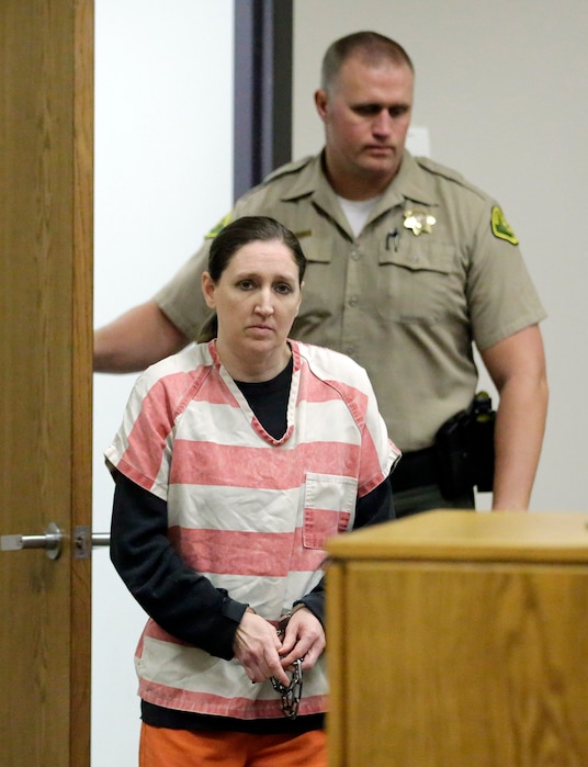 Megan Huntsman, who is accused of killing six of her seven newborns and storing all of their bodies in her garage, appears in court Monday, Dec. 8, 2014, in Provo, Utah. Huntsman waived her right to a preliminary hearing. Police say Huntsman, 39, strangled or suffocated the infants from 1996 to 2006, and that a seventh baby found in her garage was stillborn. Investigators say Huntsman was addicted to methamphetamine and didn't want to care for the babies. (AP Photo/Rick Bowmer, Pool)