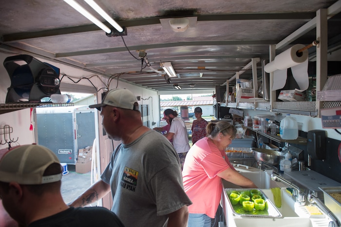 (Rachel Molenda  |  The Salt Lake Tribune) Volunteers help prepare food in the Sunset Grill mobile kitchen on Tuesday, Sept. 5, 2017. The Moab, Utah, restaurant arrived in Kountze, Texas, on Sunday to help with Hurricane Harvey relief efforts.