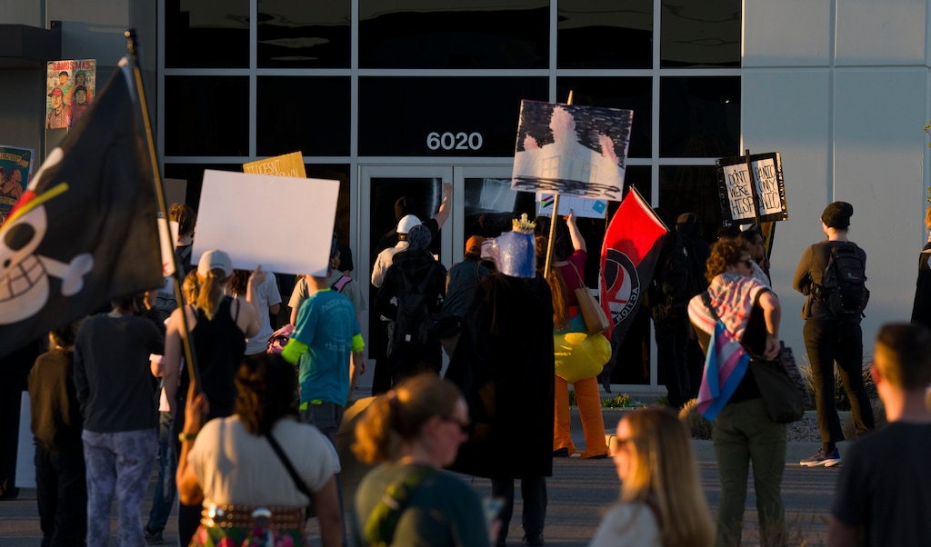(Bethany Baker  |  The Salt Lake Tribune) Protesters gather at the warehouse purchased for U.S. Immigration and Customs Enforcement in Salt Lake City on Wednesday, March 18, 2026.