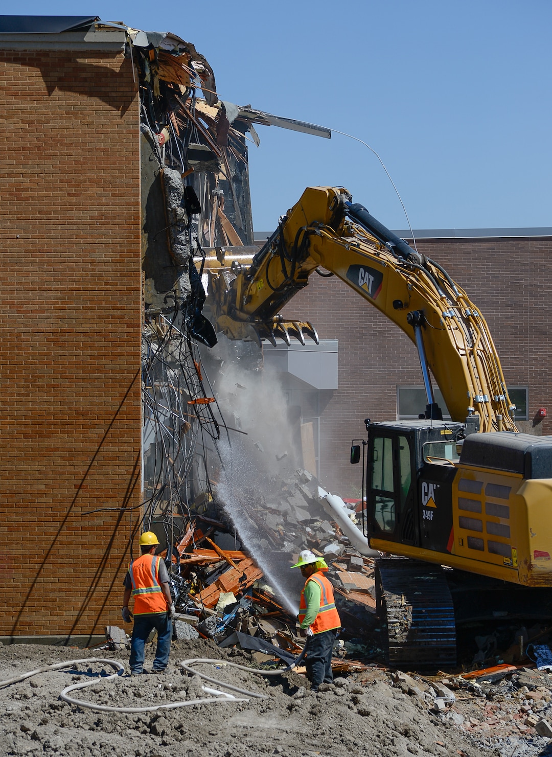 (Francisco Kjolseth  |  The Salt Lake Tribune)  Work begins tearing down the old West Jordan Middle School, 7550 S. Redwood Road, the oldest school in the Jordan School District on Tuesday, July 16, 2019.