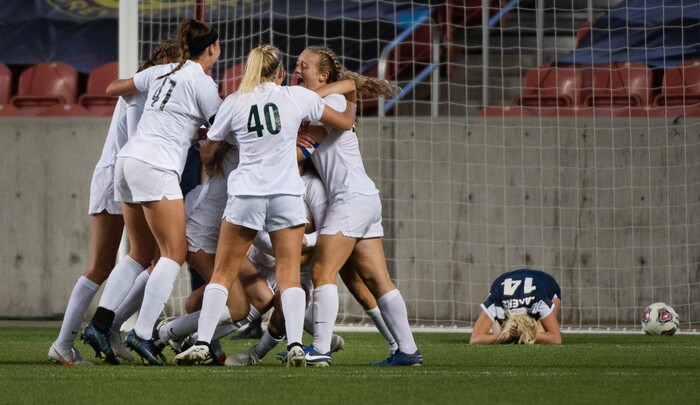 (Francisco Kjolseth  |  The Salt Lake Tribune) Emma Neff #9 of Olympus is mobbed by teammates following her game winning header in overtime over Bonneville during their 5A high school girls championship game at Rio Tinto Stadium in Sandy on Friday, Oct. 23, 2020. Bonneville won 1-0 in overtime.