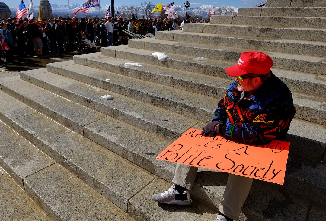 (Francisco Kjolseth  |  The Salt Lake Tribune) Steve Tobias of South Jordan hold a sign that reads "Armed Society Is A Polite Society," as he listens to speakers during a pro gun rally at the Utah Capitol in Salt Lake City on Saturday, Feb. 8, 2020, in response to recent proposals from legislators, including red-flag laws, universal background checks and the elimination of private transfers.