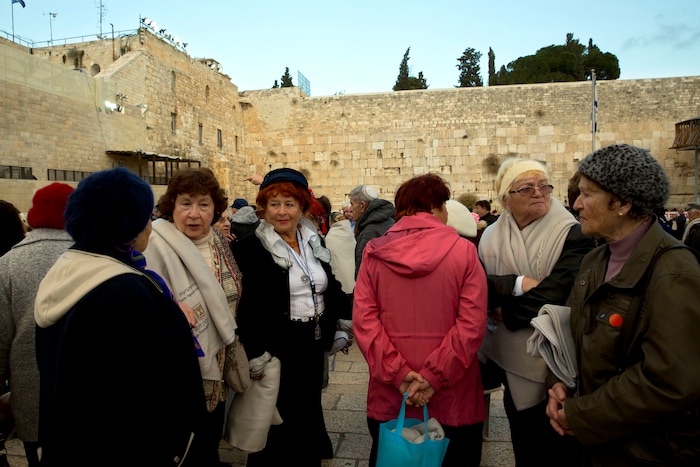 Holocaust survivors stand at the Western Wall, the holiest site where Jews can pray in Jerusalem, Thursday, Dec. 14, 2017. (AP Photo/Sebastian Scheiner)