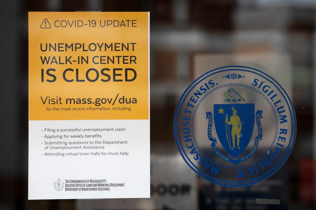 (Michael Dwyer | AP file photo)  A sign announces the closure of the Massachusetts Unemployment Office, Saturday, May 9, 2020, in Boston.