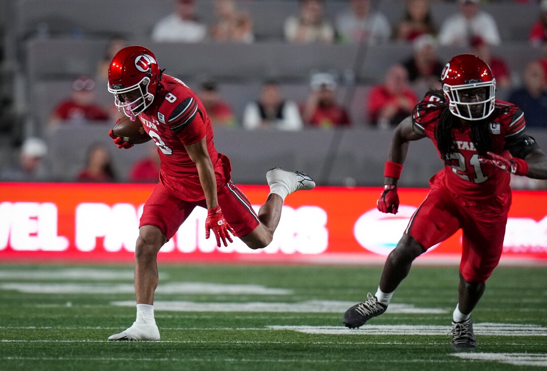 (Bethany Baker  |  The Salt Lake Tribune) Utah Utes wide receiver Mana Carvalho (8) runs the ball as safety Nate Tilmon (21) looks to block during the first half of the game between the Utah Utes and the Idaho Vandals at Rice-Eccles Stadium in Salt Lake City on Thursday, Sept. 3, 2026.
