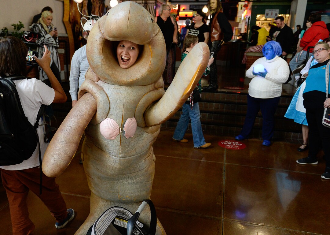 (Francisco Kjolseth  |  The Salt Lake Tribune)  Kristyna Williams, dressed as a manatee from the show "How I Met Your Mother" joins FanX's twice-annual "press conference," drawing cosplayers to Megaplex Jordan Commons in Sandy on Wed. June 12, 2019, for the announcement of the event's celebrity visitors.