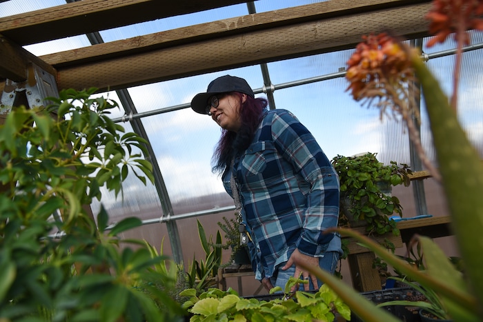 (Francisco Kjolseth  |  The Salt Lake Tribune)  Jenn Harris, a former recovery resident at the Center for Women and Children in Murray, loves volunteering her time now at the Freedom Garden across the street where residents can learn how to grow fruits and vegetables and make strides towards rehabilitation. The garden has been a place of healing and also acts as a memorial for those who have passed in their battle with substance abuse with stones bearing their names in the garden. 