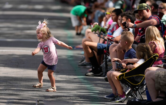 (Francisco Kjolseth | The Salt Lake Tribune) And Vanbibber, 2, dances away to a marching band as she and her family take in the Days of ’47 Parade in Salt Lake City on Saturday, July 23, 2022.