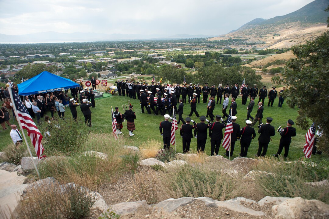 (Rick Egan  |  The Salt Lake Tribune)  The casket carrying Matthew Burchett is carried by the pall bearers at East Lawn Memorial Hills Cemetery in Provo, Monday, Aug. 20, 2018.