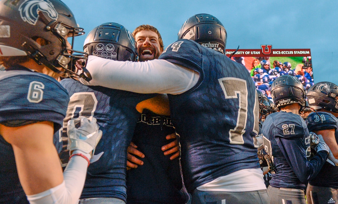 (Leah Hogsten  |  The Salt Lake Tribune)  Corner Canyon head coach Eric Kjar is mobbed after the win. High School defeated American Fork High School 49-14 during the 6A State Championship football title, Nov. 22, 2019 at Rice-Eccles Stadium.