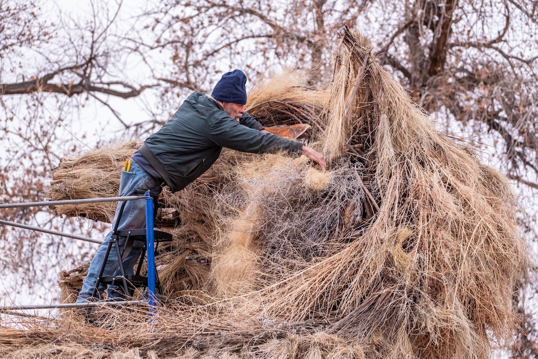 (Photo courtesy of John Gregor | Cold Snap Photography) Artist Joe Pachak at work on his winter solstice sculpture in 2018.