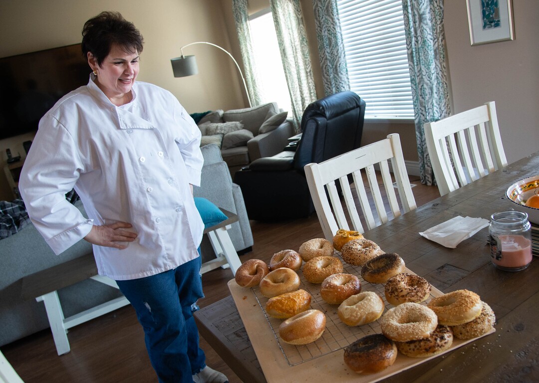 (Francisco Kjolseth  | The Salt Lake Tribune) Baker Cheryl Mignone (www.cherylsbagels.com) shows off the bagels she makes in the commercial kitchen in her home in Kaysville. The hand rolled east coast style bagels have proven to be popular, with people ordering online and picking up off her porch.