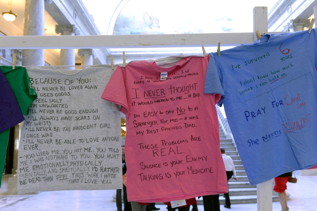 (Al Hartmann  |  The Salt Lake Tribune) T-shirt messages from the "Clothesline Project" hang in the Utah Capitol rotunda. The t-shirts on display were created by survivors of abuse or in honor of someone who has died in violence against women.