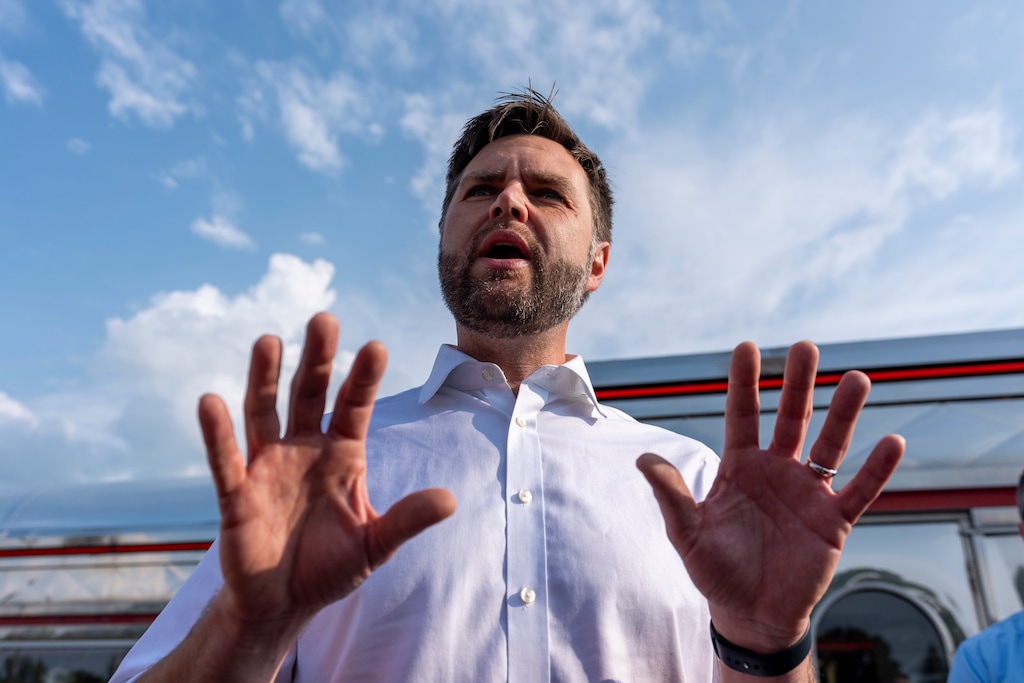 (Alex Brandon | AP) Republican vice presidential candidate Sen. JD Vance, R-Ohio, speaks with reporters outside the Park Diner, Sunday, July 28, 2024, in Waite Park, Minn.