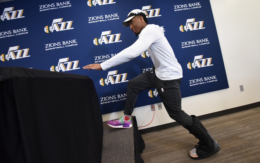 (Francisco Kjolseth  |  The Salt Lake Tribune)  Utah Jazz      guard Donovan Mitchell arrives to speak with the media during exit interviews wearing a boot at their practice facility in Salt Lake City Wed., May 8, 2018, after losing to the Houston Rockets in game 5 of their Western Conference Semifinals during the 2018 NBA Playoffs.
