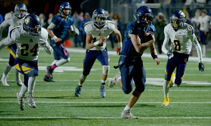 (Leah Hogsten | The Salt Lake Tribune) Juan Diego's Tristen Tonozzi runs in a touchdown. Summit Academy boys' football team leads Juan Diego High School 51-35 during their game, October 13, 2017 in Draper.