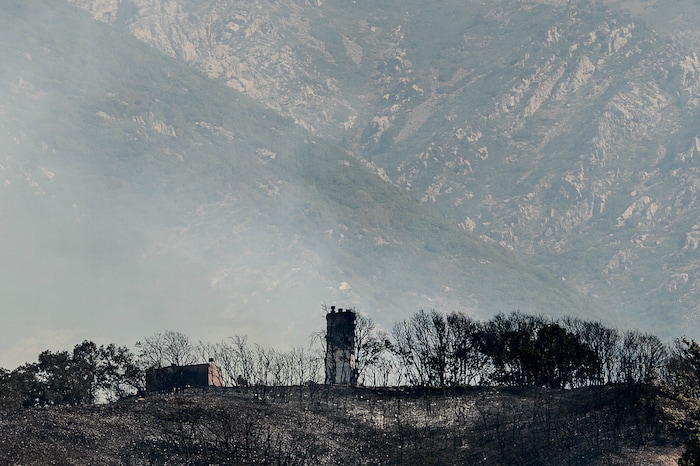 (Trent Nelson | The Salt Lake Tribune)  A home appears to be destroyed as a fire burns at the mouth of Weber Canyon, Tuesday September 5, 2017.