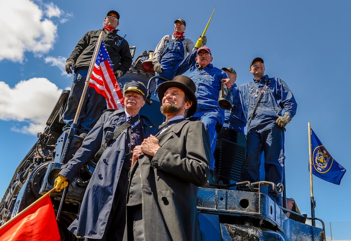 Leah Hogsten  |  The Salt Lake Tribune  Big Boy No. 4014 crew including Jim Leonard, Jimmy Thompson, Ed Dickins, Bruce Kirk and Austin Barker pose for pictures with historical presenter John Voehl dressed as President Abraham Lincoln. In celebration for the 150th anniversary of the transcontinental railroadÕs completion, Union Pacific's iconic steam locomotives, Living Legend No. 844 and Big Boy No. 4014 met at Ogden Union Station, May 9, 2019.