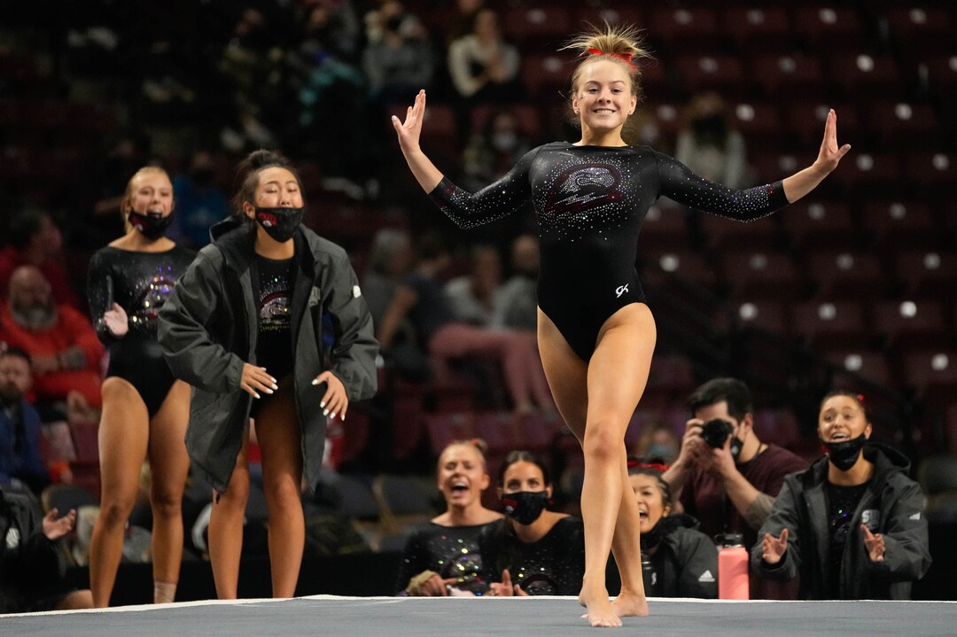 (Francisco Kjolseth | The Salt Lake Tribune) Southern Utah University’s Kayla Horton is cheered on by teammates as she completes her floor routine at the Best of Utah NCAA Gymnastics Meet at the Maverik Center in West Valley City on Friday, Jan. 7, 2022.