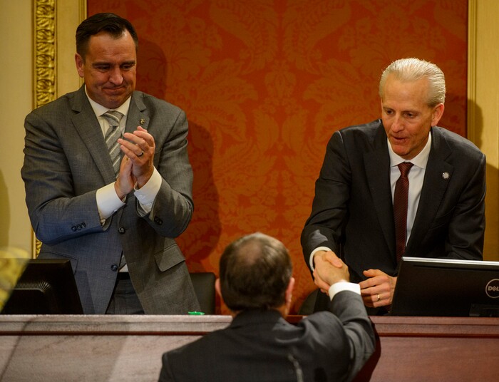 (Steve Griffin  |  The Salt Lake Tribune) Speaker of the House Greg Hughes applauds as Senate President Wayne Niederhauser shakes hands with Gov. Gary Herbert as he leaves the Utah House of Representatives after giving his State of the State address in Salt Lake City Wednesday January 24, 2018.
