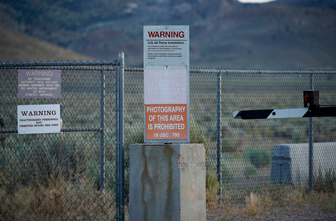 (John Locher | AP Photo) In this July 22, 2019 photo, signs warn about trespassing at an entrance to the Nevada Test and Training Range near Area 51 outside of Rachel, Nev. The U.S. Air Force has warned people against participating in an internet joke suggesting a large crowd of people "storm Area 51," the top-secret Cold War test site in the Nevada desert.