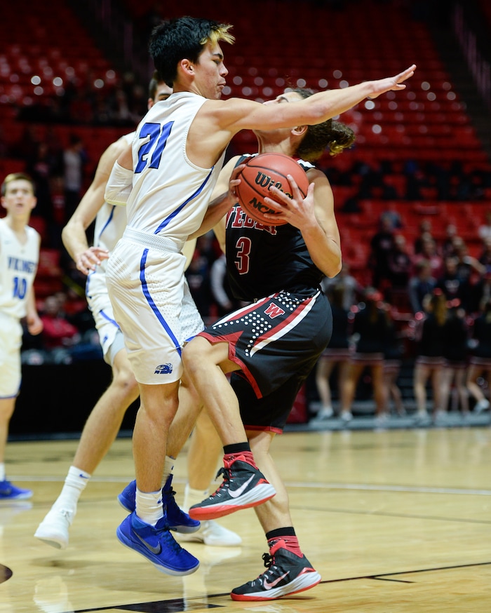 (Francisco Kjolseth  |  The Salt Lake Tribune)  Weber vs Pleasant Grove, 6A State high school basketball tournament at the Huntsman Center in Salt Lake City, Thursday March 1, 2018. Pleasant Grove's Kawika Akina (21) puts the brakes on Hudson Schenck (3). 
