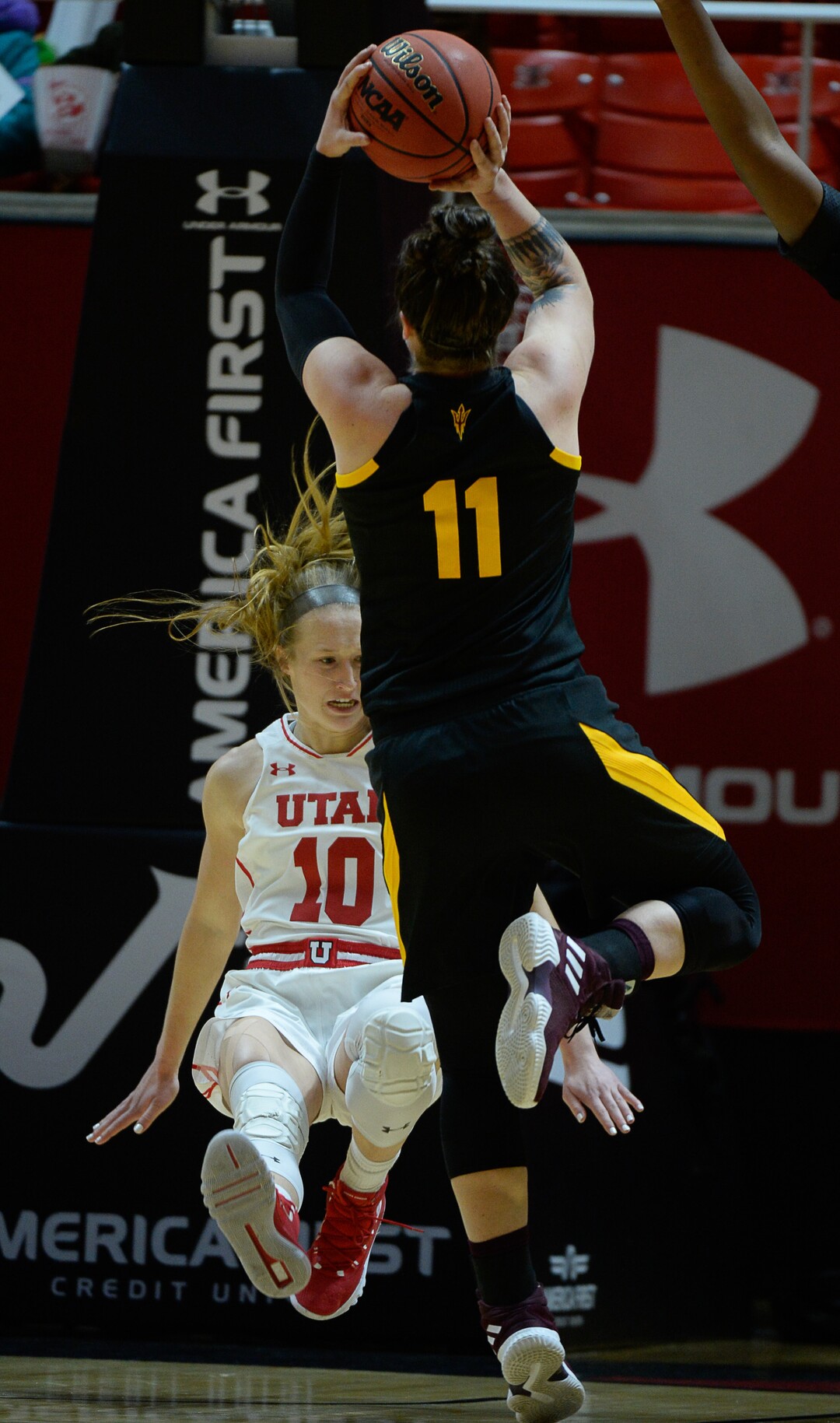 (Francisco Kjolseth  |  The Salt Lake Tribune)  Utah Utes guard Dru Gylten (10) goes for a ride after a hit by Arizona State Sun Devils guard Robbi Ryan (11) in Utes' Pac-12 home opener at the Jon M Huntsman Center on Friday, Jan. 4, 2019. They're off to one of their best starts in team history.